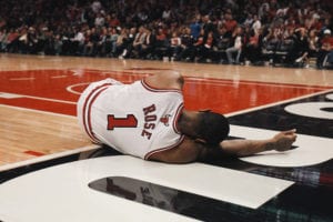 DEVASTATION: Derrick Rose in the moments after tearing his ACL in the second round of the 2012 Playoffs (April 28, 2012).