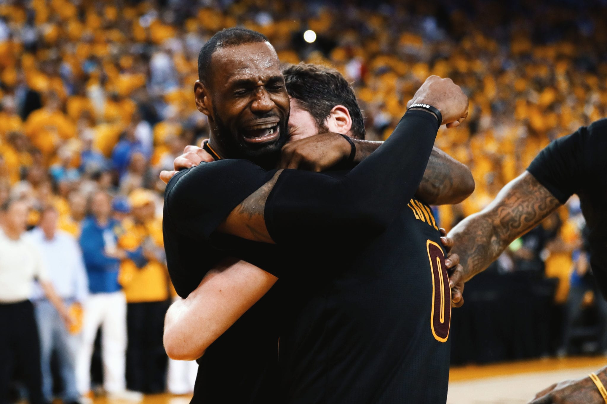 PROMISE KEPT: LeBron James embraces Kevin Love as the Cleveland Cavaliers come back from 3-1 down to win the 2016 NBA championship against the Golden State Warriors (June 19, 2016). 