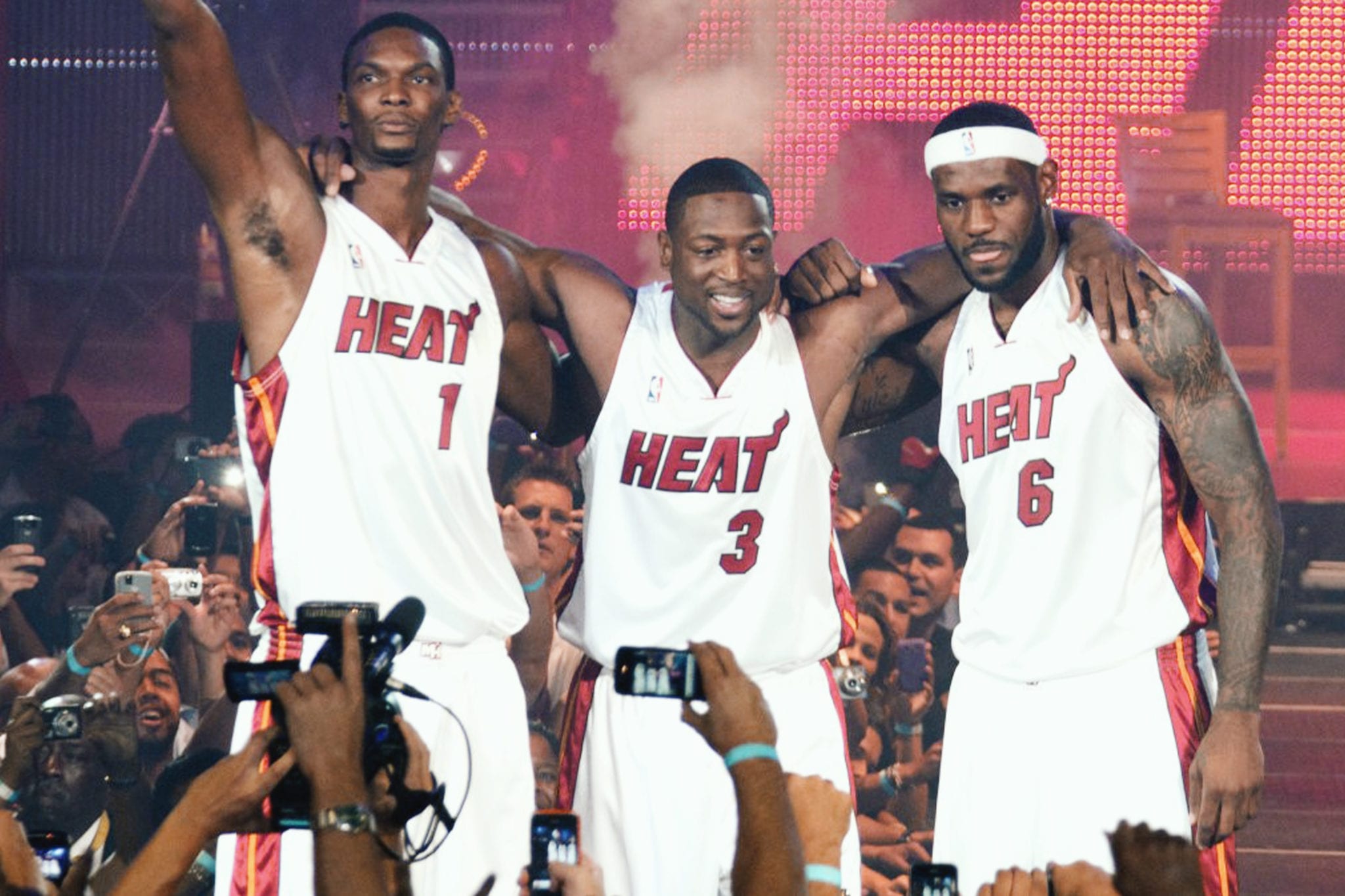 NOT ONE, NOT TWO, NOT THREE: Chris Bosh, Dwyane Wade and LeBron James live it up at the Miami Heat's Big 3 welcome party (November 20, 2010). 