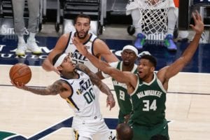 Giannis Antetokounmpo of the Bucks defending Jordan Clarkson